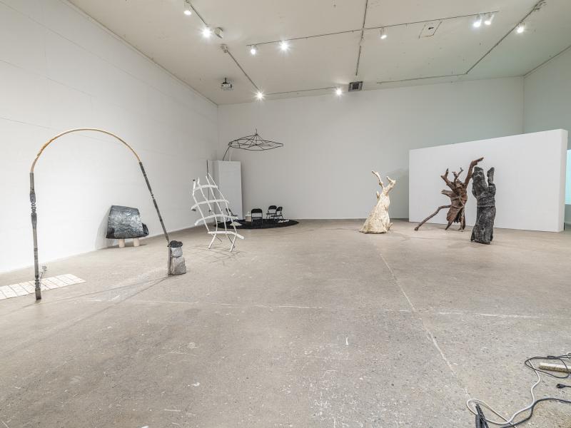 Installation image of multiple floor sculptures in a vast exhibition space