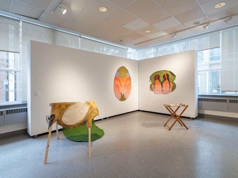 image of multiple paintings and floor sculptures in a gallery
