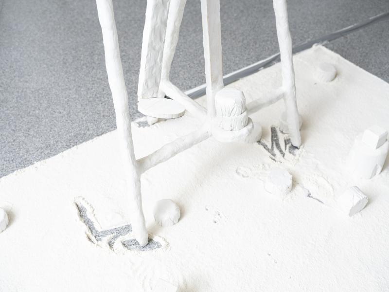 detail of floor sculpture with plaster pieces placed on a flour ground surface 