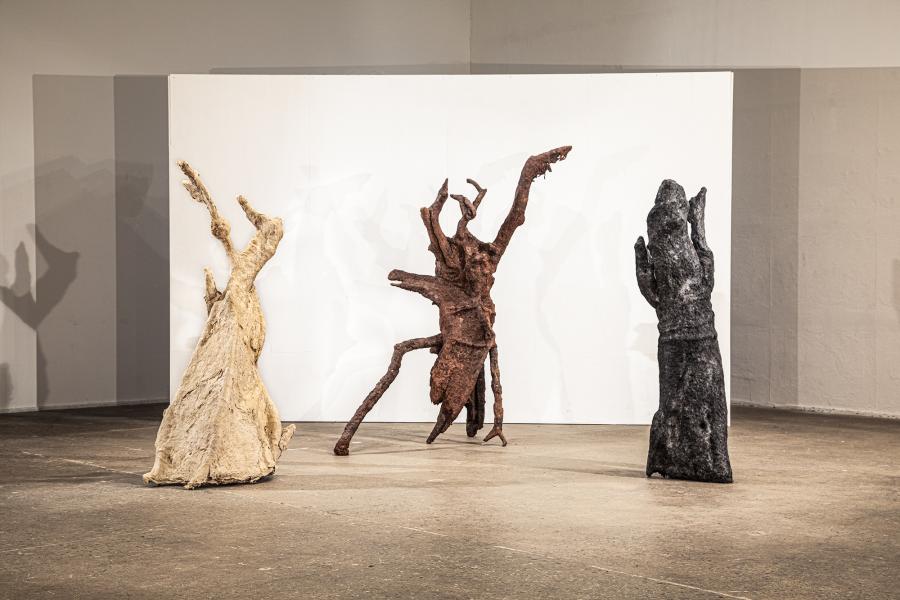 multiple floor sculptures using mulberry paper, sand, clay, decaying wood