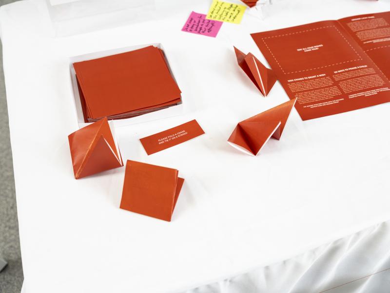 detail image of red paper on table for folding paper cranes