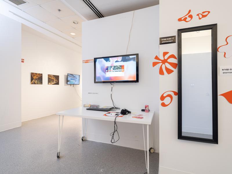 installation of multiple design pieces and a desktop setup in a gallery
