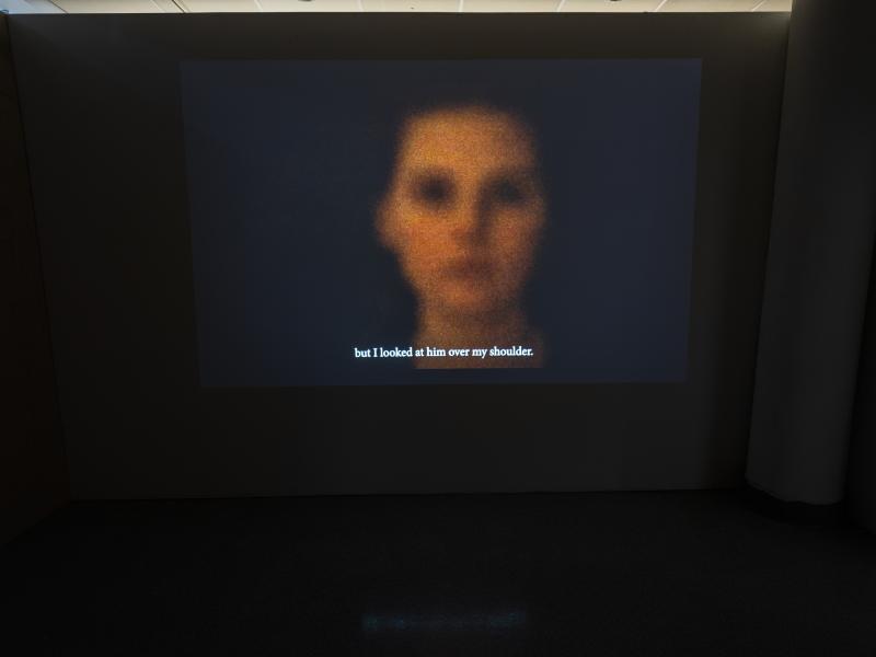 projected image of human head with black background