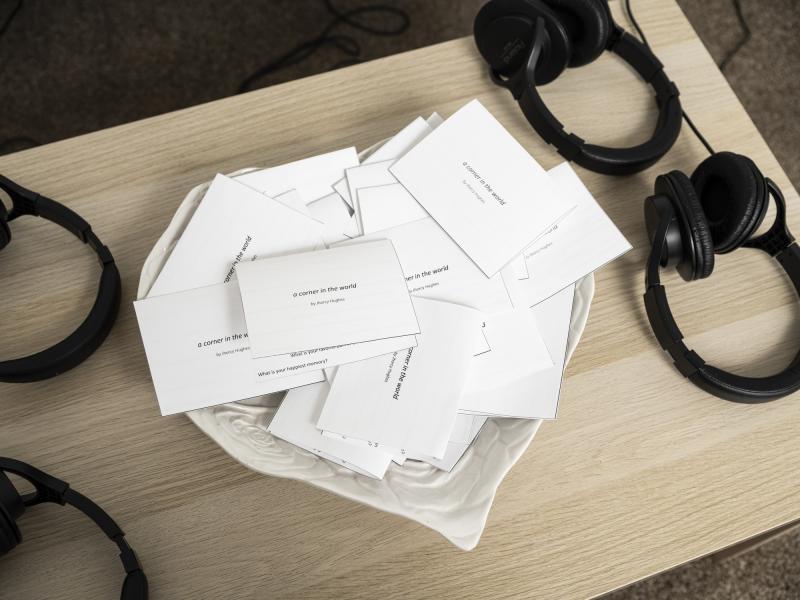 detail image of headphones and cards on a coffee table