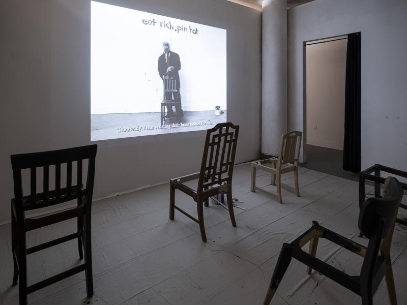 projection in dark space with chairs