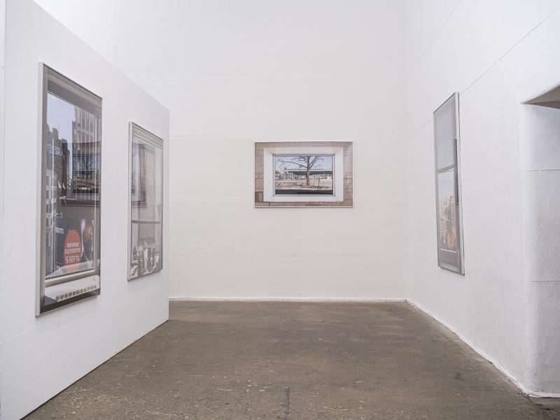 installation image of four large scale photographs