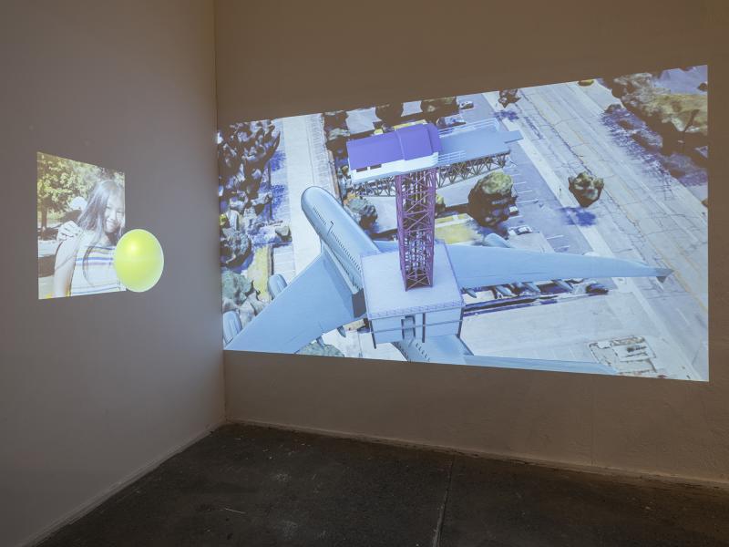 installation image of a dual projected digital video piece