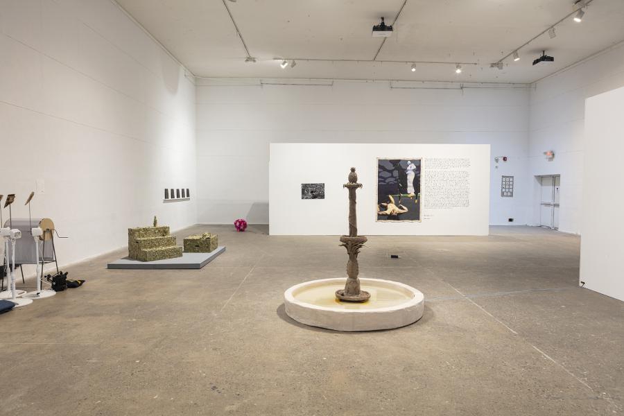 Installation image of multiple artworks including floor and wall sculptures, photography, and painting