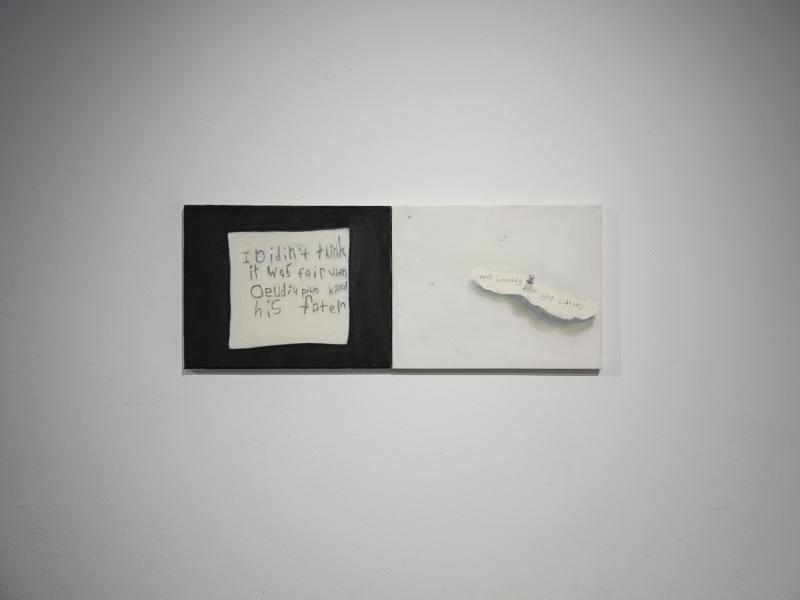 two small paintings installed on a gallery wall