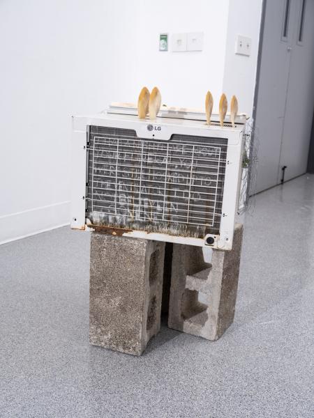 detail image of a mixed media sculpture using a window unit a/c unit