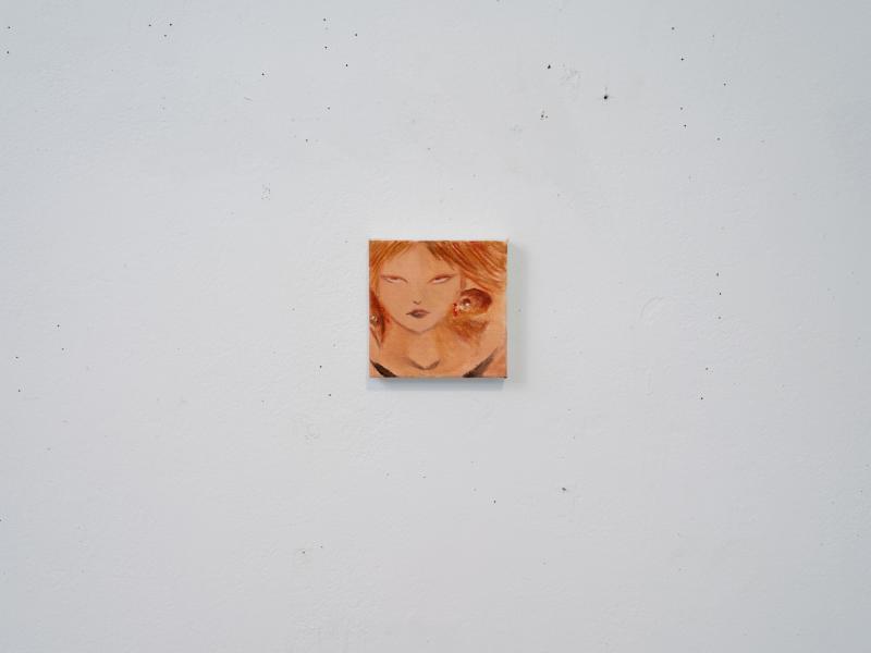 small painting installed on a gallery wall
