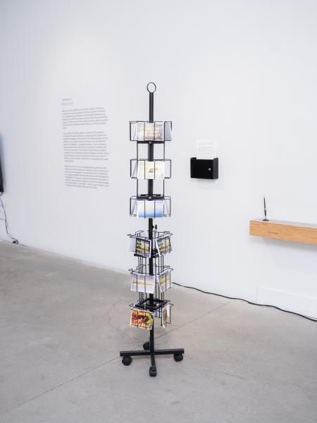 installation image of an installed rack of postcards