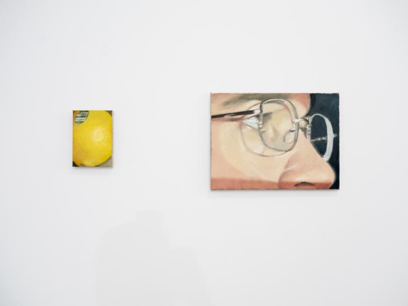 two small painting installed on a gallery wall