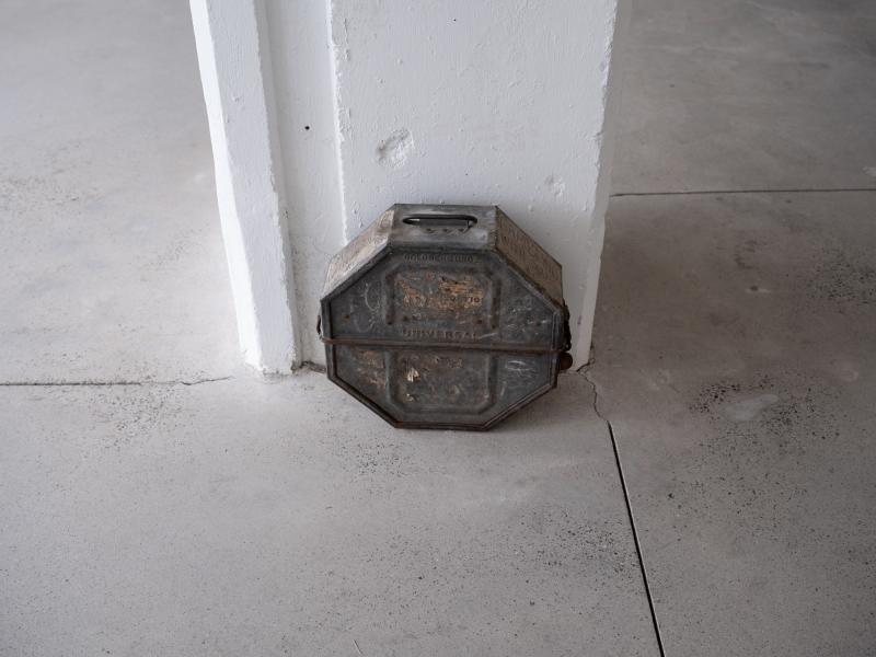 installation image of a film canister on a gallery floor