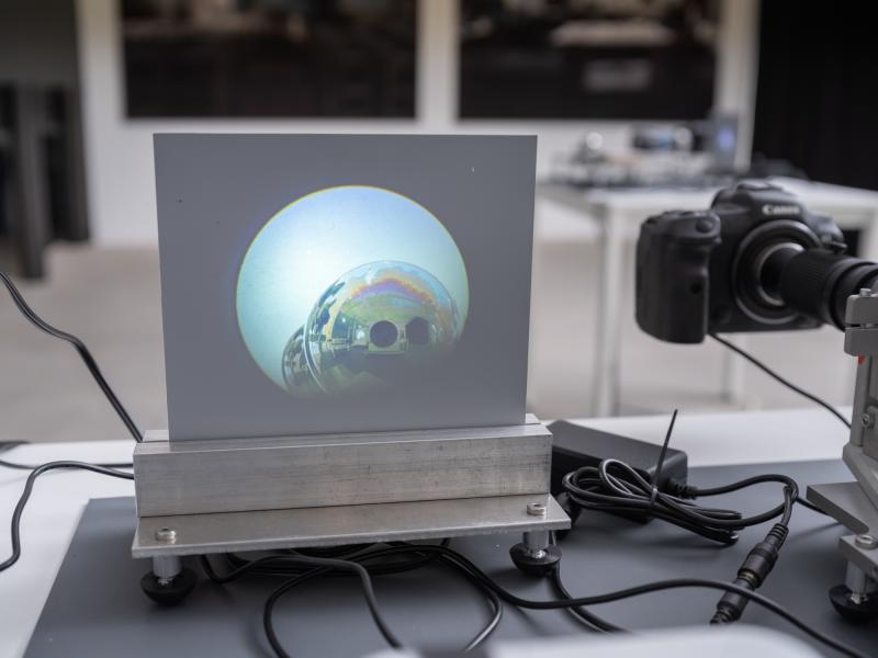 detail of a small scale projection and camera on a table