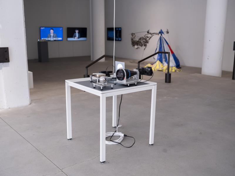 installation image of a small scale projection and camera on a table