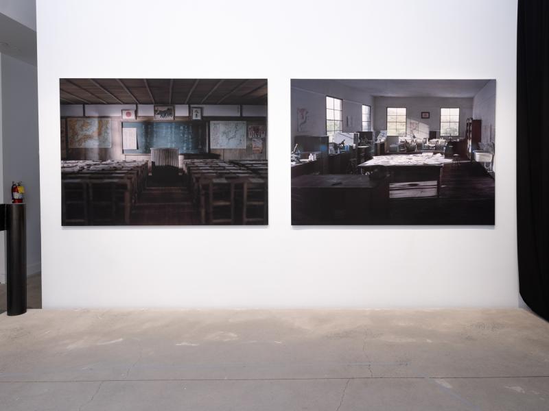 two large format photographs installed on a gallery wall