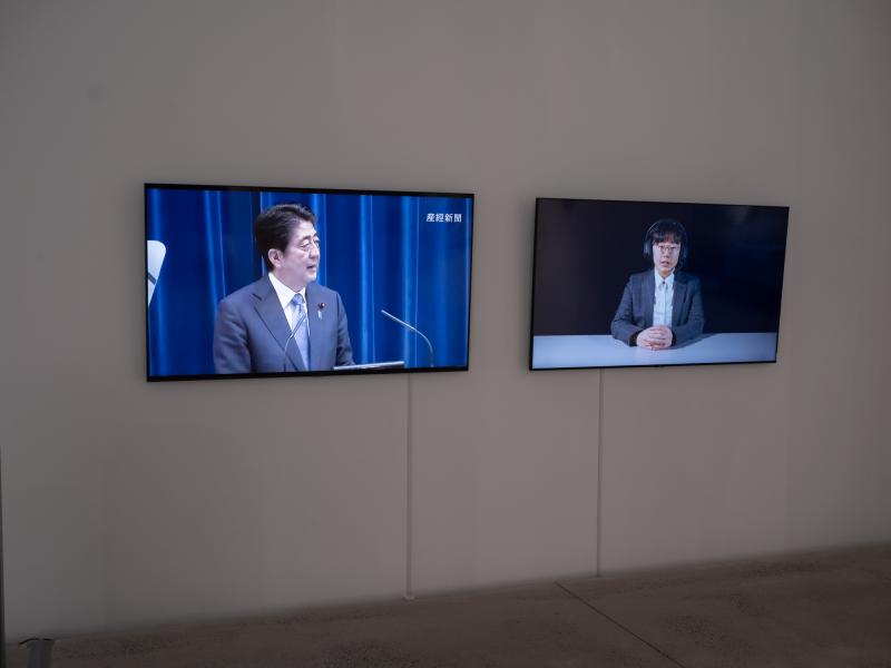 image of two monitors installed on a gallery wall