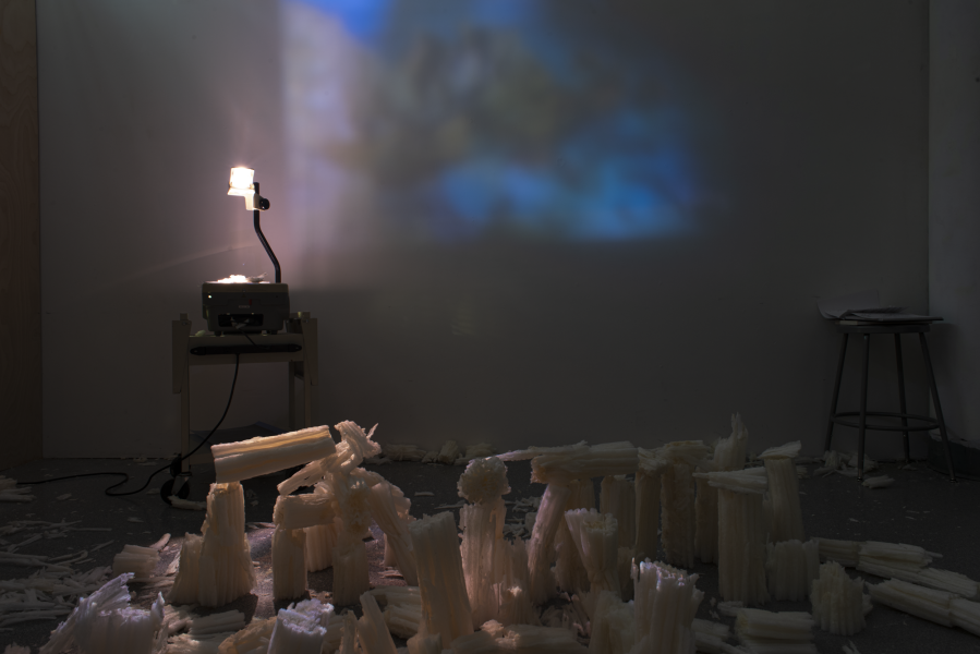 multi media installation in a dark space using an overhead projector and foam