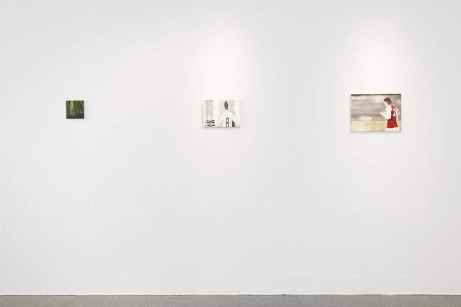 three small figurative paintings installed on a gallery wall