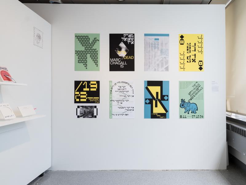 multiple posters using graphics and text installed on a wall