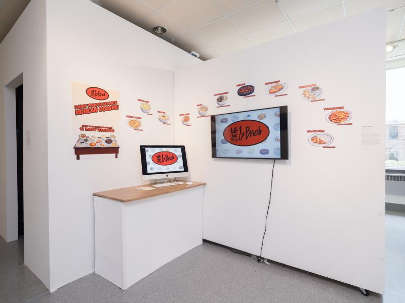 installation of multiple graphics installed in a corner, a monitor, and a desktop on a pedestal