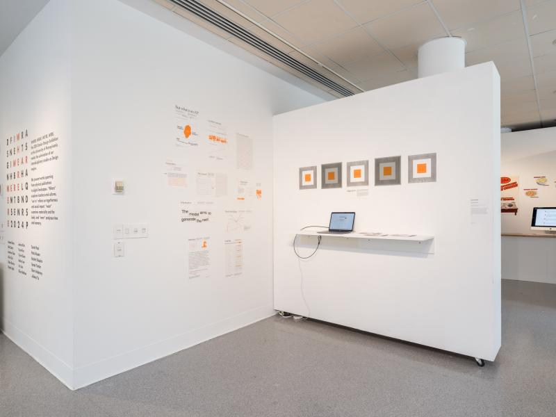 installation image of multiple graphics installed in a corner and a laptop on a shelf