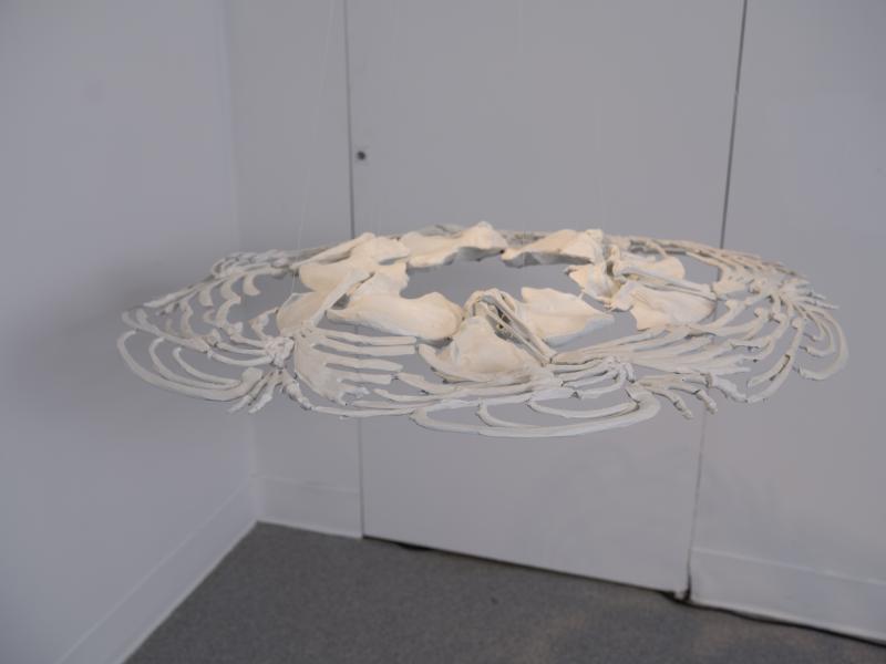 detail image of a sculpture suspended from the ceiling