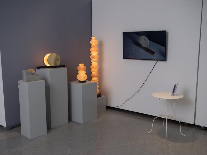 installation using multiple salt lamps, a monitor, and side table