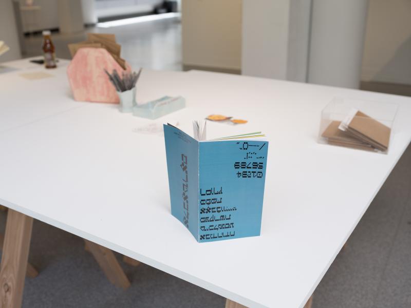 detail image of an open book standing upright on a table