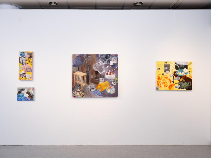 multiple paintings installed on a gallery wall