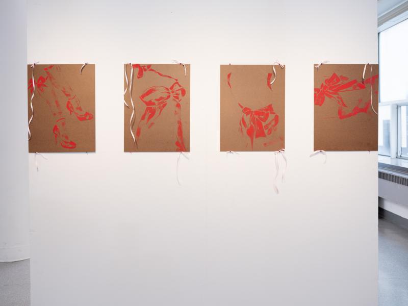 four mixed media paintings installed in a row on a gallery wall