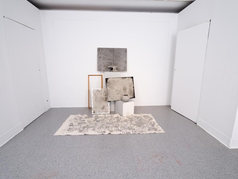 mixed media installation installed on the wall and floor of a gallery