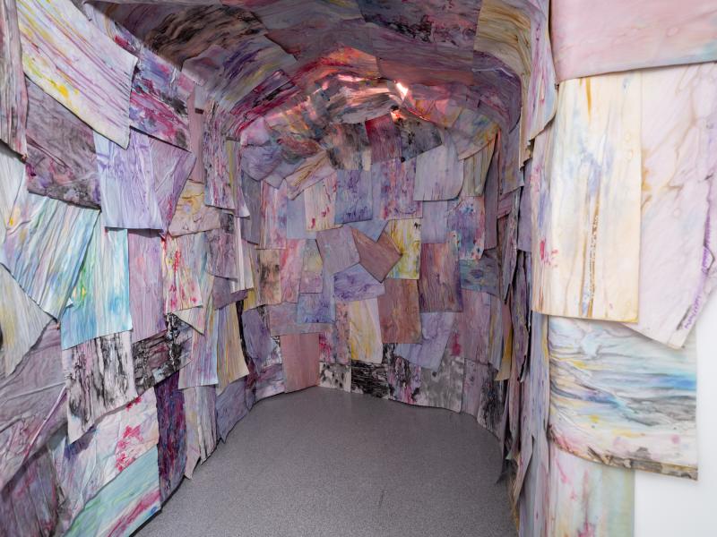 installation using multiple works on paper installed on the walls and ceiling of a gallery