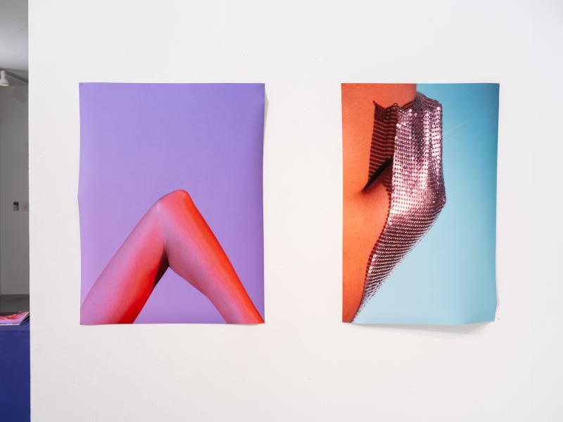 two photographs installed on a gallery wall