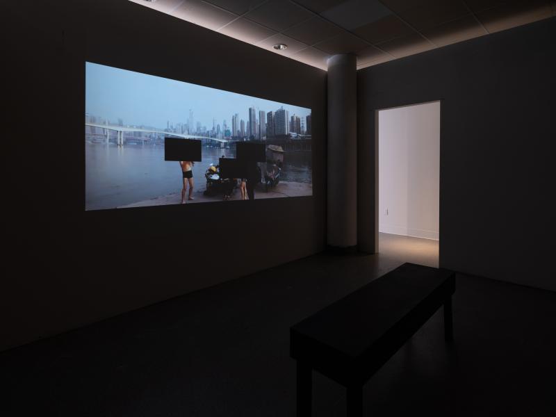 projected digital video in a dark gallery viewing room