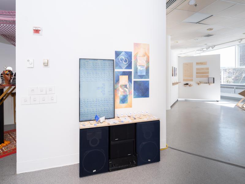 installation of several mixed media works, monitor with digital video and, a stereo