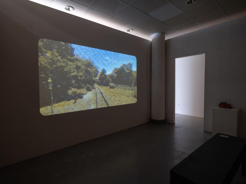 digital video projection in a dark gallery space