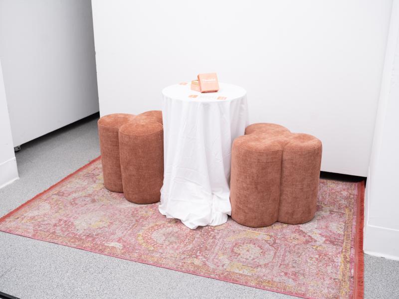 mixed media installation with stools and cards installed on a table