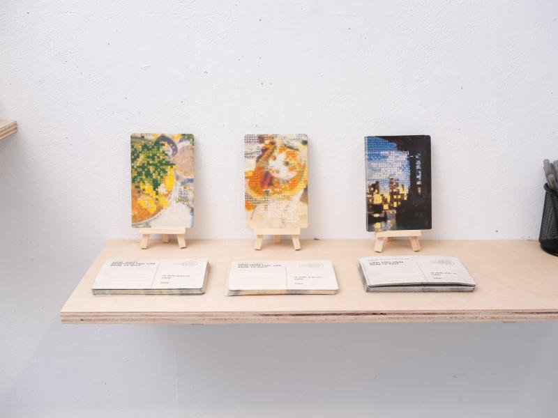 detail image of postcards installed on a shelf