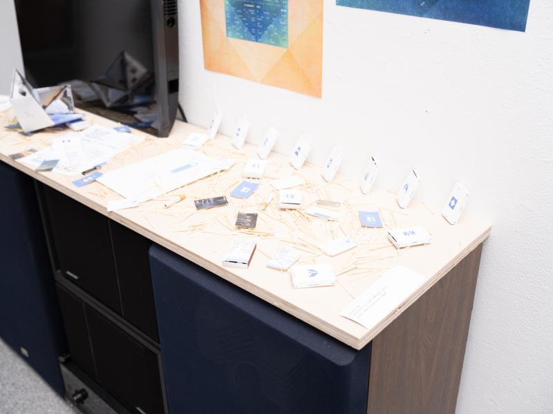 detail image of mixed media pieces installed on top of a stereo 
