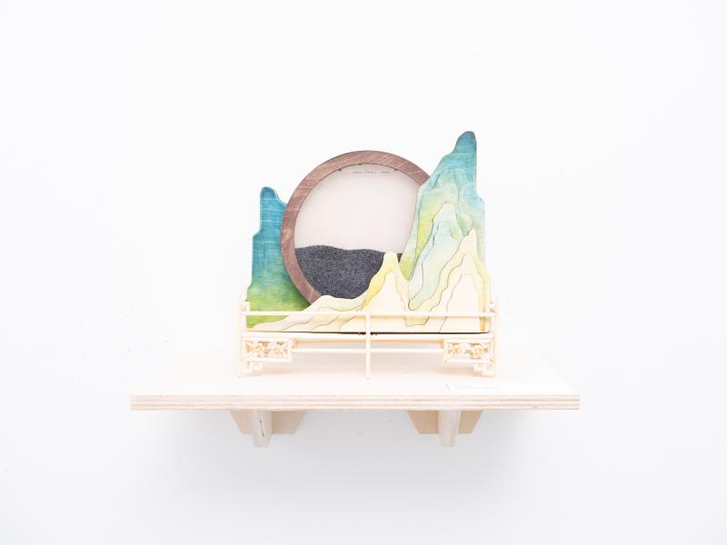 detail of a mixed media sculpture installed on a shelf