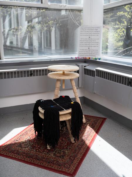 mixed media installation installed on the floor and window sill of a gallery