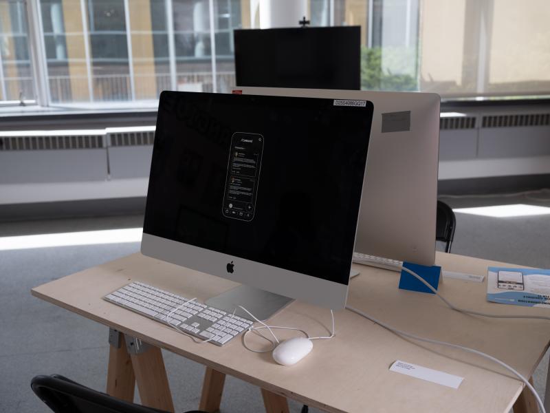installation of a monitor displaying an app installed on a desk