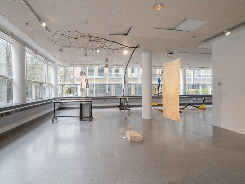 installation image with multiple sculptures and digital photo