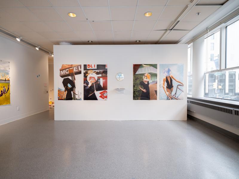 installation of multiple large scale photographs, a mirror, and a shelf