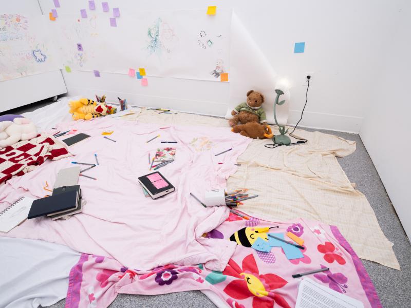installation of a mixed media on the floor and walls of a gallery