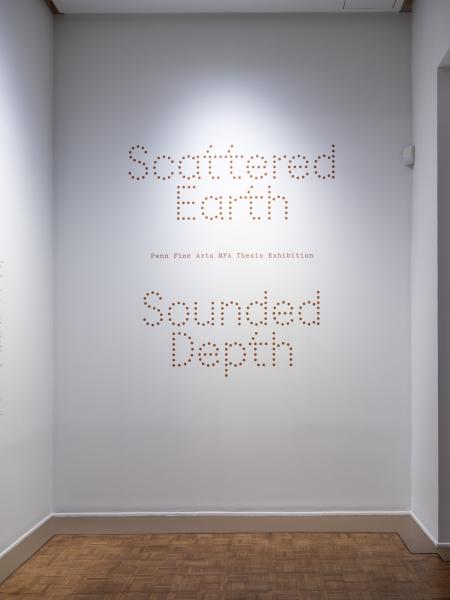 gallery entry displaying the exhibition title in vinyl on the gallery wall