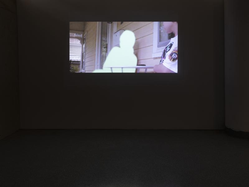 projected image in a dark gallery setting