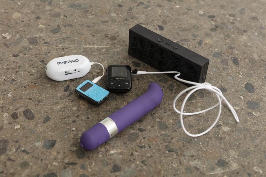 image of a floor sculpture using a purple vibrator, small audio speaker, and audio devices